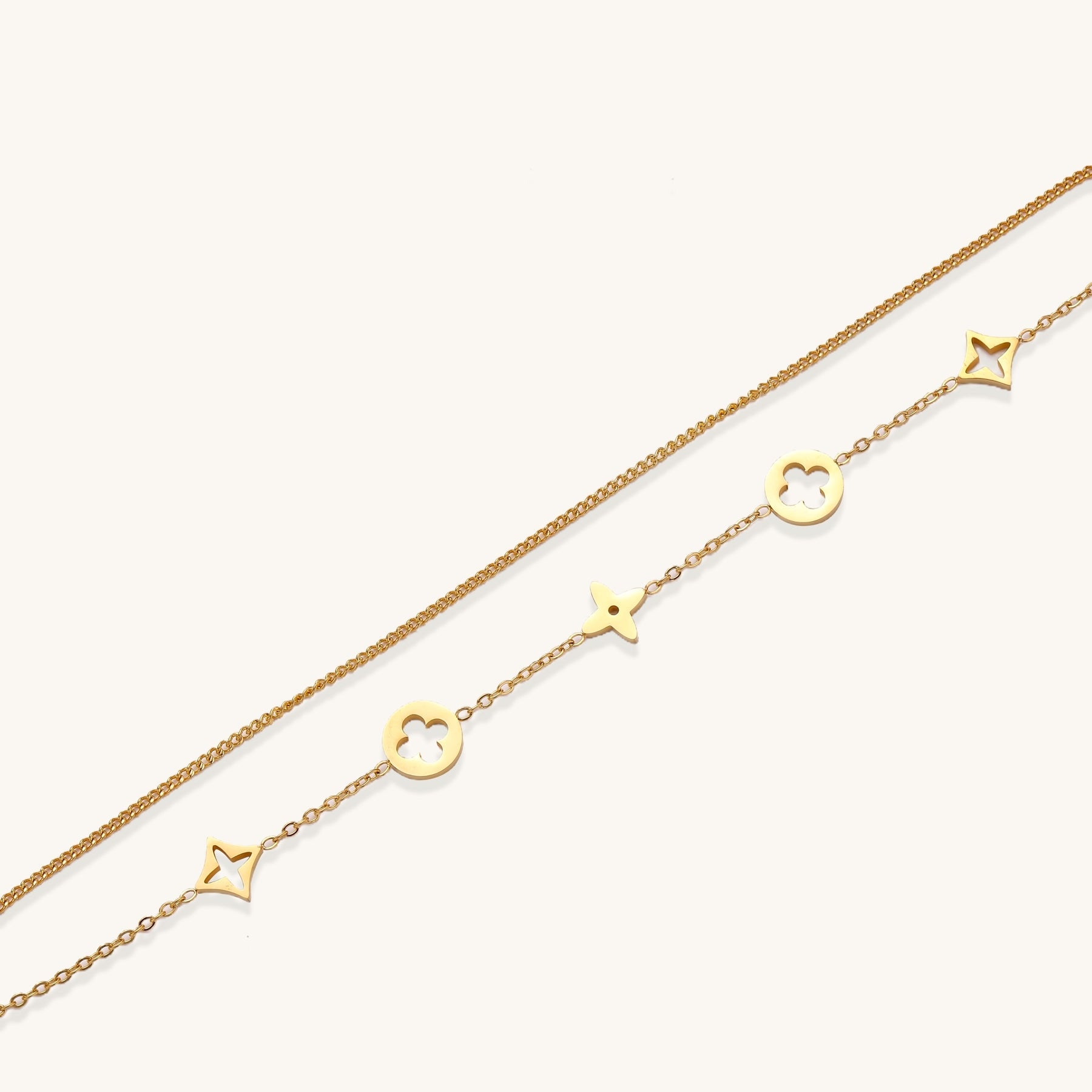 Dainty gold-plated bracelet with star and clover charms on double chain with adjustable extender