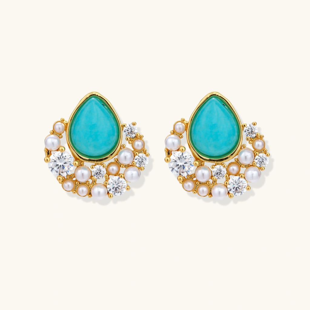 Gold-plated cluster earrings with teardrop turquoise stones surrounded by white pearls and clear crystals